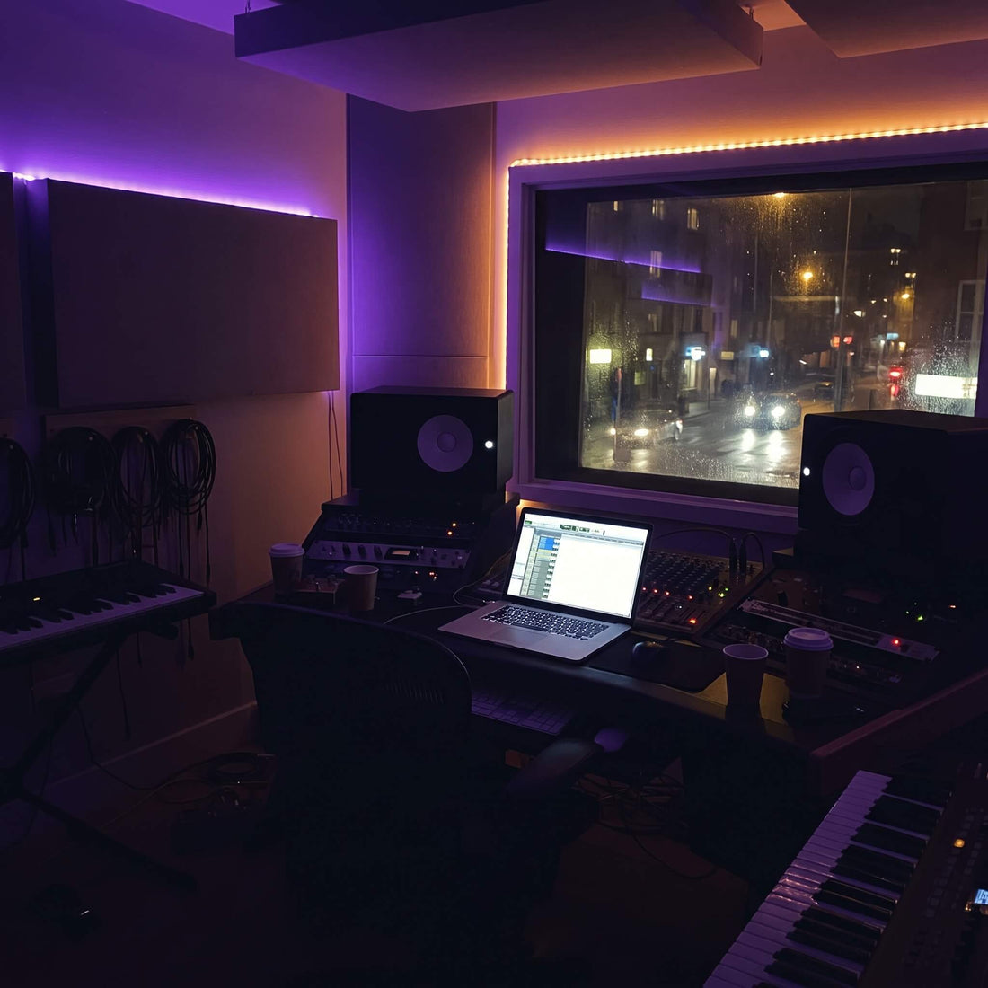 Dark moody home studio at night with glowing monitors, representing how to make Trap Soul beats
