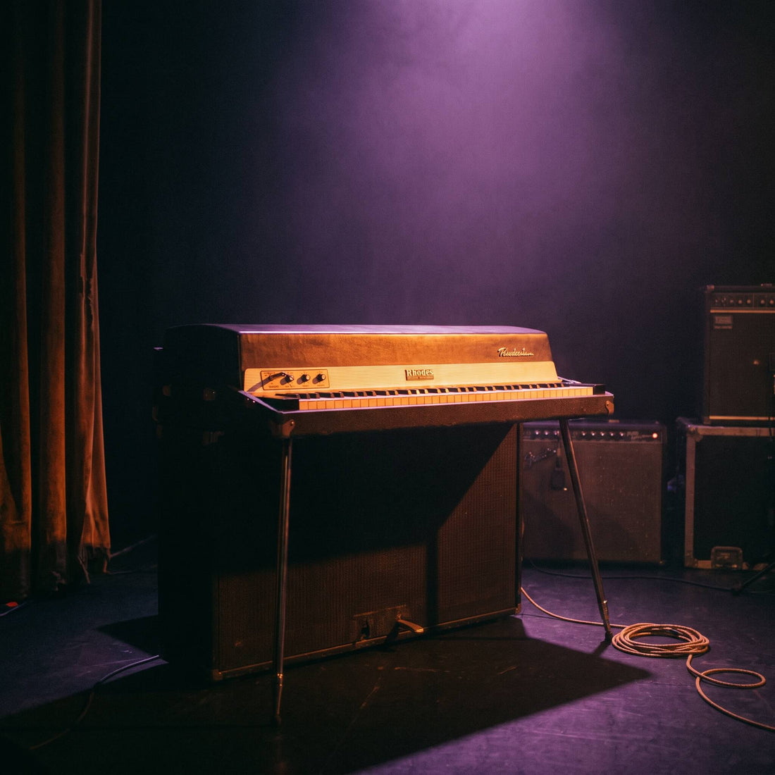 Vintage Rhodes electric piano glowing under warm amber light, representing Soul MIDI progressions