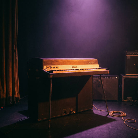 Vintage Rhodes electric piano glowing under warm amber light, representing Soul MIDI progressions